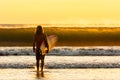 Mesmerizing scenery of male entering the sea at sunset at Jiquilillo beach