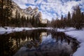 Mesmerizing scenery of a reflection of snowy rocky mountains in the lake Royalty Free Stock Photo