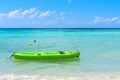 Mesmerizing shot of a beautiful seascape with green kayak
