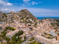 Mesmerizing shot of the beautiful townscape of Taormina with hill and buildings