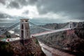 Mesmerizing shot of Clifton Suspension Bridge over the Avon Gorge in a gloomy day, Bristol, UK Royalty Free Stock Photo