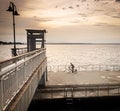 Mesmerizing shot of a cyclist riding on the bridge