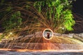 Mesmerizing shot of a Hispanic young man making steel wool fireworks