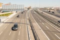 Mesmerizing shot of a long road with a lot of automobiles on a sunny day