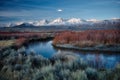 Mesmerizing shot of a river and the amazing landscapes under the blue sky