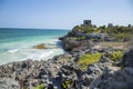 Mesmerizing shot of a rocky cliff by the ocean in Tulum, Mexica