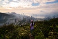 Mesmerizing shot of a young female enjoying the view of Hong Kong city