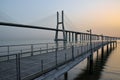 Mesmerizing sunrise view over the Vasco of Gama Bridge on the Tagus River in Lisbon, Portugal Royalty Free Stock Photo