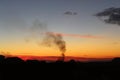 Mesmerizing sunset and chimney smoke Royalty Free Stock Photo