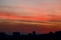 Mesmerizing sunset sky over the silhouettes of buildings