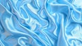 Mesmerizing swirls of light blue satin fabric flow and cascade, creating a serene and elegant visual texture. Royalty Free Stock Photo