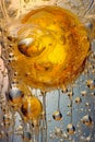 Mesmerizing Underwater Wallpaper with Pouring Golden Liquid Bubbles
