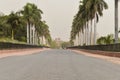 A mesmerizing view of architecture of small tomb at old fort from side lawn with palm trees Royalty Free Stock Photo