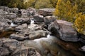 Mesmerizing view of the  Castor river crashing into the stones in the forest in Ozark, Missouri Royalty Free Stock Photo