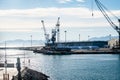 Mesmerizing view of cranes and port work area against a blue sky