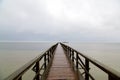 Mesmerizing view of the endless jetty to the horizon with a turquoise sea and blue sky Royalty Free Stock Photo