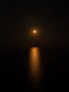 Mesmerizing view of the golden moon over the sea Royalty Free Stock Photo