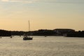 Mesmerizing view of the golden sunset over the sea with sailing boats Royalty Free Stock Photo