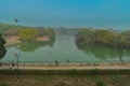 A mesmerizing view of hauz khas lake and garden from the hauz khas fort at hauz khas village at winter foggy morning