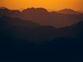 Mesmerizing view of the high hills on a foggy day at sunset Royalty Free Stock Photo