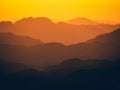 Mesmerizing view of the high hills on a foggy day at sunset Royalty Free Stock Photo