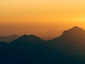 Mesmerizing view of the high hills on a foggy day at sunset Royalty Free Stock Photo