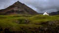 Mesmerizing view of an isolated house in the small fishing village of Arnarstapi in Iceland
