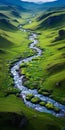 Tranquil Aerial View Of Colorful River And Lush Grasslands