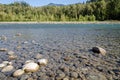 Mesmerizing view of the Vedder River winding through Chilliwack, BC, Canada. Pebbles on the river bed are clearly visible in the