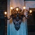 Mesmerizing view of the wall light fixture in an antique style building Royalty Free Stock Photo