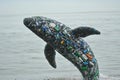 Mesmerizing Whale Breaching at Ocean Surface Amidst Plastic Pollution Crisis Royalty Free Stock Photo