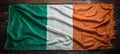 Mesmerizingly vibrant irish flag elegantly unfurling against a breathtakingly picturesque background