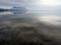 Mesolongi lagoon with calm sea reflecting clouds and sun Royalty Free Stock Photo