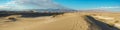 Mesquite Sand Dunes, mountains and cloudy sky background, panoramic view. Death Valley National Park Royalty Free Stock Photo