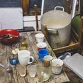 A mess in the garage on the dining table after heavy drinking and eating food, the foreground and background are blurred with Royalty Free Stock Photo