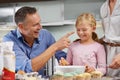 Mess is half the fun. a family baking together and laughing. Royalty Free Stock Photo