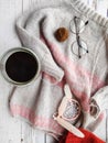 Knitter`s table, morning coffee and unfinished knitting project