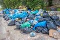 Mess trash containers and many garbage bags in Glyfa, Corfu island. Greece