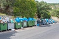 Mess trash containers and many garbage bags in Glyfa, Corfu island. Greece