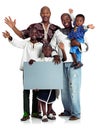 A message for all types of families. Studio shot of two african men with their kids holding a blank board, isolated on Royalty Free Stock Photo