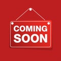 Message announcement signboard with coming soon information text hanging on button pin isolated on red background. EPS10 Royalty Free Stock Photo