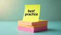 Message best practice on yellow note paper. Stack of colorful stickers on table. Reminder on colorful sticky note. Memo at Royalty Free Stock Photo