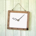 Message board of dollar sign clock hanging on wooden wall