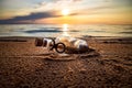 Message in the bottle against the Sun setting down Royalty Free Stock Photo