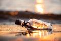 Message in the bottle against the Sun setting down Royalty Free Stock Photo