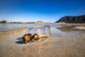 Message in the bottle against the Sun setting down Royalty Free Stock Photo