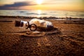 Message in the bottle against the Sun setting down Royalty Free Stock Photo