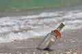 Message in a bottle on the beach Royalty Free Stock Photo