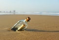 Message in a bottle on the beach Royalty Free Stock Photo