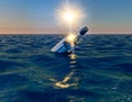 Message in the bottle, bottle floating in the ocean at sunset Royalty Free Stock Photo